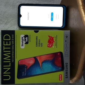 A strait talk wireless samsung galaxy  A 20 4G  32 GB memory cell phone